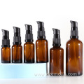 Empty glass amber cosmetic skincare cream pump bottle